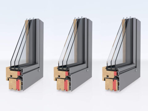 Schéma de coupe d'une fenêtre bois-alu : bois côté intérieur, capot aluminium côté extérieur
